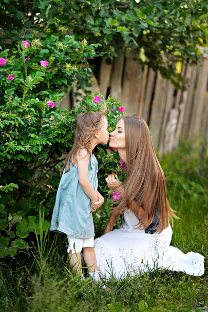 portrait of mother and daughter in nature - Photo, Image