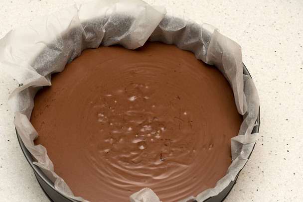 Mix of a chocolate cake prepared to put the meringue on it and put it in the oven - Photo, Image