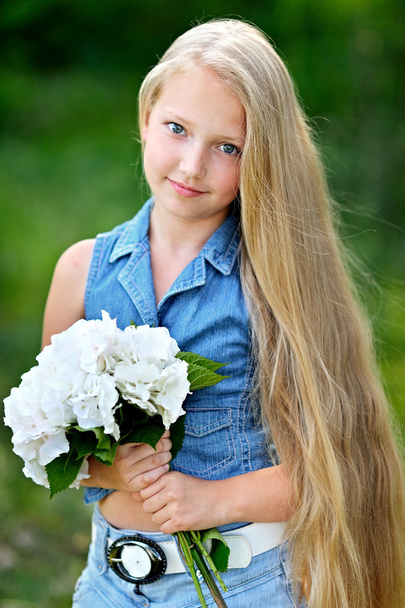 portrait of little girl outdoors in summer - Fotó, kép