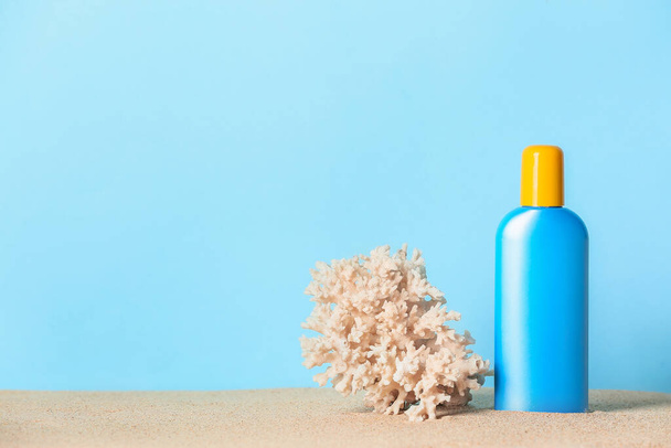 Bottle of sunscreen on color background - Photo, Image