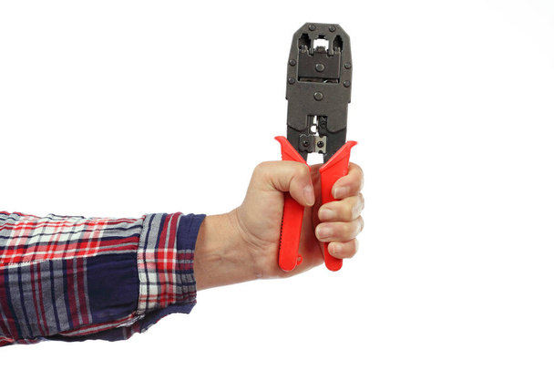 DIY, hand and arm of a handyman with a checkered shirt holding a stripping pliers on a white background, iillustration of the concept made by yourself or home made, DIY course - Foto, immagini