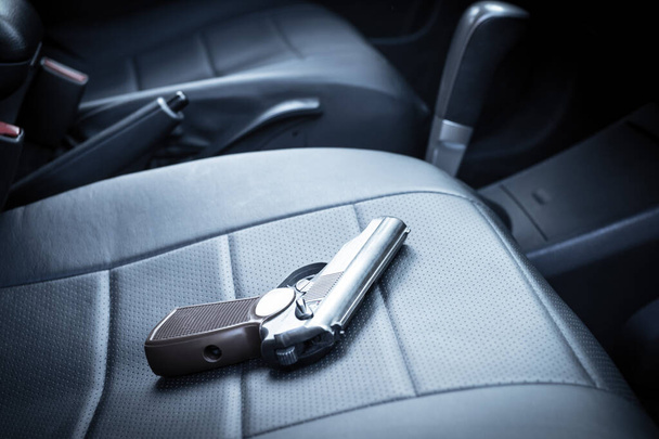 the gun is on the car seat. criminal district of the city - Fotó, kép