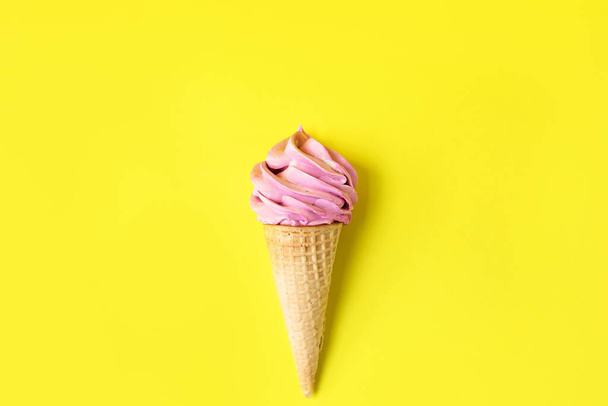 Homemade berry marshmallows in a waffle cone, on a bright yellow background. The concept of healthy sweets made from natural ingredients. - Photo, image