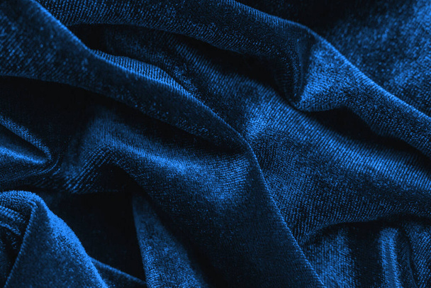 The texture background of the velvet fabric dark blue color. Classic blue color of the year 2020 - Φωτογραφία, εικόνα