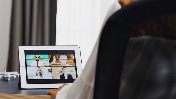 Woman talking with her colleagues during a video call - Photo, Image