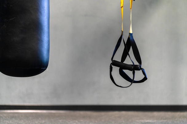 A punching bag and TRX tapes - Photo, Image