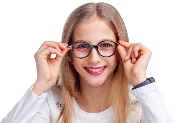 girl teenager in glasses for vision in the studio - Foto, afbeelding