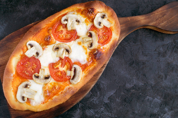 Traditional Italian dish, delicious pizza with mushrooms. - Photo, Image