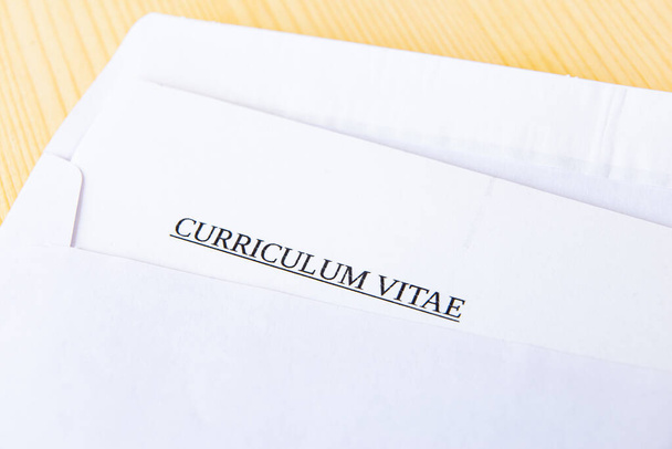 Curriculum vitae in an envelope; send and receive a vurriculum vitae - Photo, Image