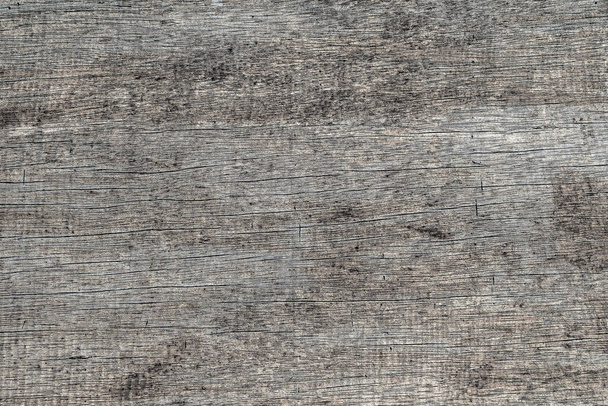 Old gray wooden wall, background and texture, close up. Rustic aged grey wooden board, top view - Foto, Imagem