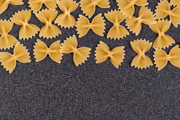 Farfalle Italian pasta. Bow Tie Pasta on grey background. Copy space. - Φωτογραφία, εικόνα