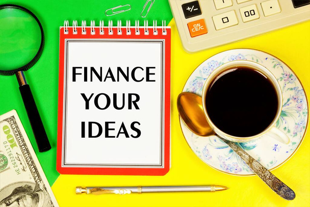Financier uw ideeën - een sms-bericht op de planning Notepad. Het vooruitzicht op inkomsten uit de vaardigheid van uitvinding in het bedrijfsleven. - Foto, afbeelding