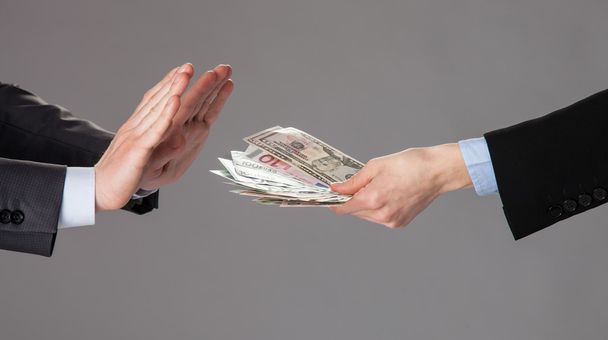 Businessman's hands rejecting a bribe - Zdjęcie, obraz