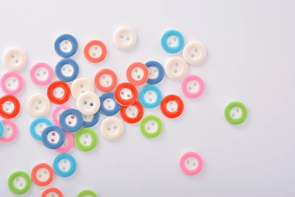 Pile of colorful buttons on white background. use for tailoring and sew - 写真・画像