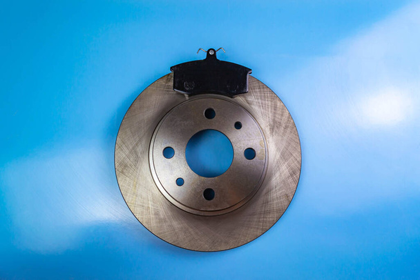 Auto parts, brake discs, pads Blue background - Photo, Image