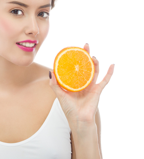 Woman is eating orange - Zdjęcie, obraz