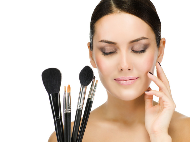 Woman with make up brushes - Foto, afbeelding