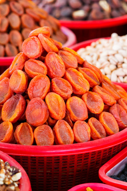 Dried fruits and nuts in the Uzbek market. - Photo, Image