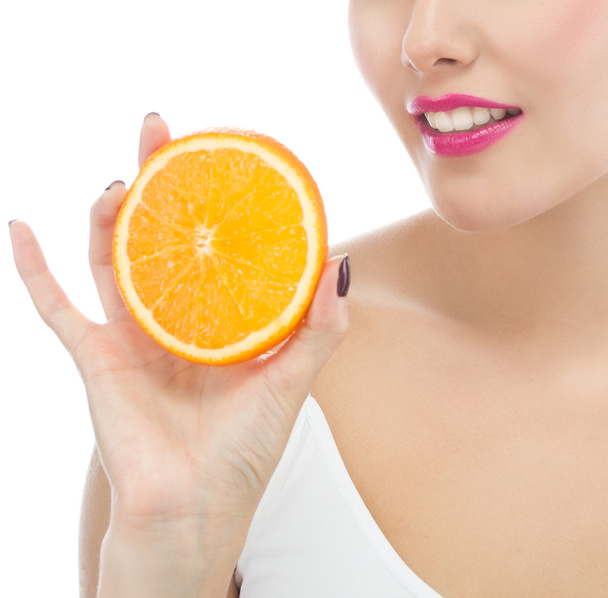 Woman is eating orange - Foto, imagen