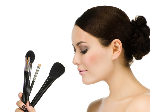 Woman with make up brushes - Φωτογραφία, εικόνα