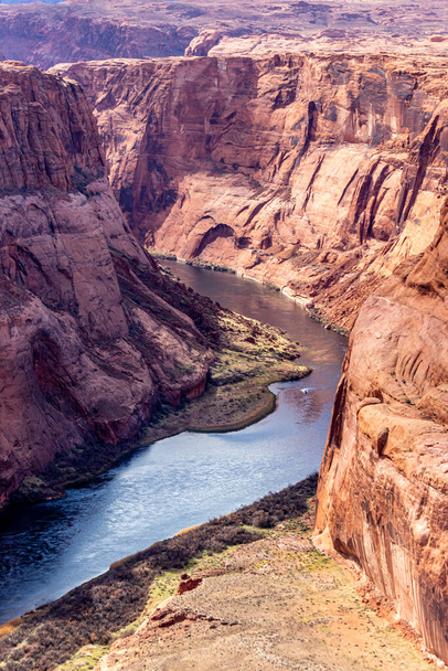 Serene river flows through the deep valley between the mountains, Horseshoe bend, Page, AZ - Photo, Image