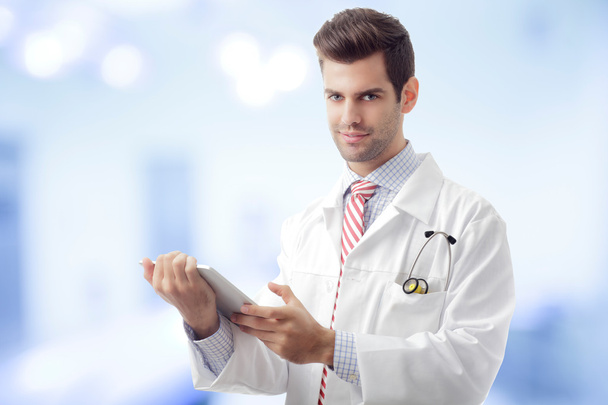 Close-up of a male doctor hands holding tablet - Fotoğraf, Görsel