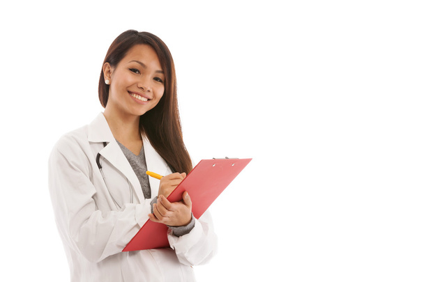 Smiling Asian doctor with chart in her hands - Фото, зображення