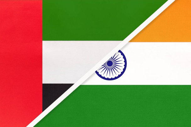 Объединенные Арабские Эмираты или ОАЭ и Индия, символ национальных флагов из текстиля. Отношения, партнерство и чемпионат между двумя азиатскими странами
. - Фото, изображение