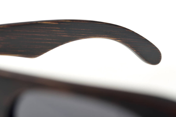 Close-up of part of wooden sun glasses - Photo, Image