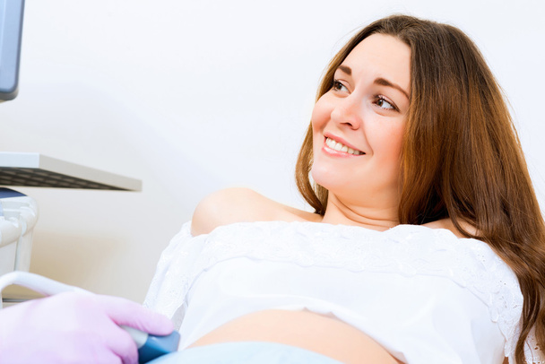Pregnant woman on reception at the doctor - Photo, image