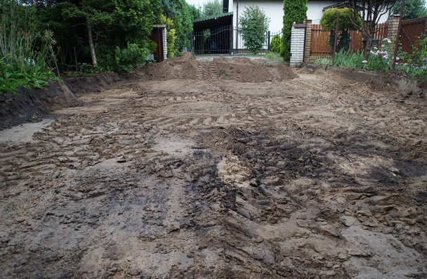 sand with traces of tires in the yard during construction - Photo, Image