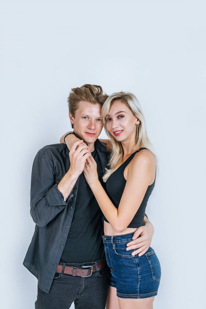 Portrait of happy young couple love together with flower in studio - Fotografie, Obrázek