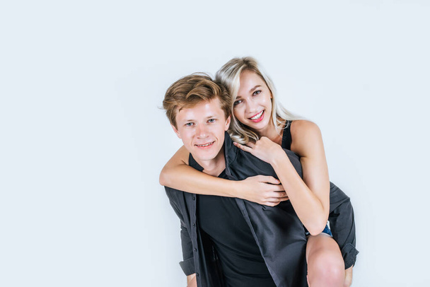 Portrait of happy young couple love together in studio - Foto, Imagem