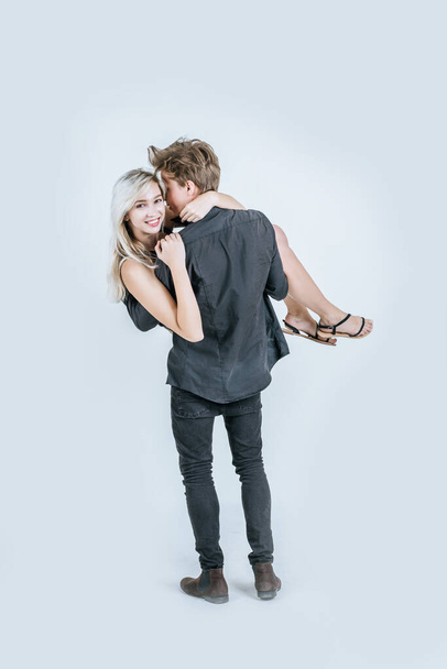 Portrait of happy young couple love together in studio - Photo, Image
