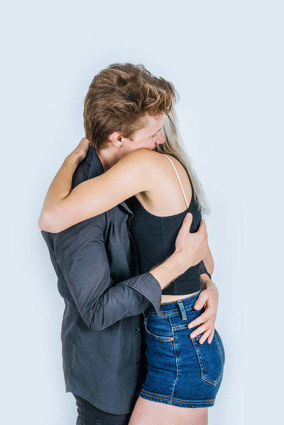 Portrait of happy young couple love together in studio - Foto, afbeelding