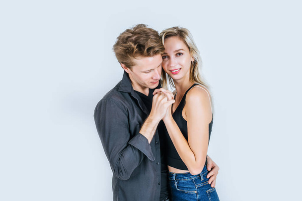 Portrait of happy young couple love together in studio - Фото, изображение