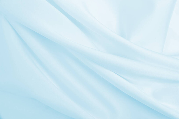Smooth elegant blue silk or satin luxury cloth texture can use as abstract background. Luxurious background design - Photo, Image