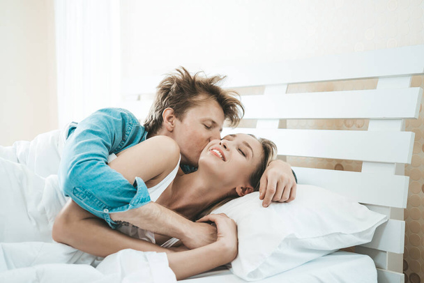 Happy Couple Playing together in the bedroom - Photo, image