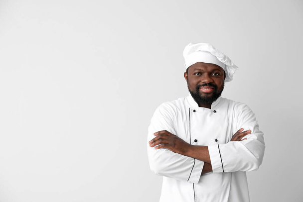 Cuoco afro-americano maschio su sfondo bianco - Foto, immagini