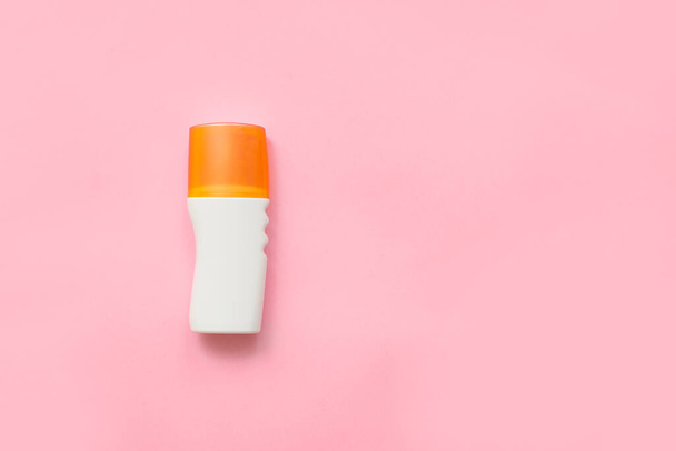 Bottle of sunscreen on color background - Photo, Image