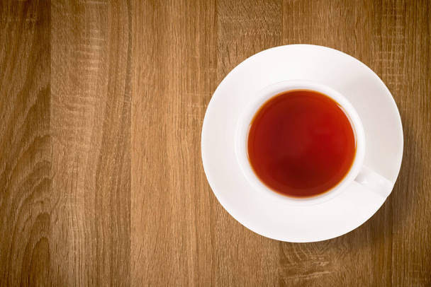 Top view cup of tea on wooden table  - Photo, Image