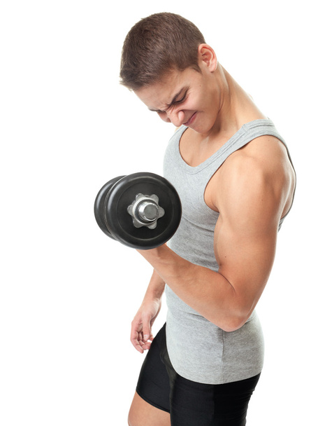 Fit man exercising with dumbbells - Photo, image