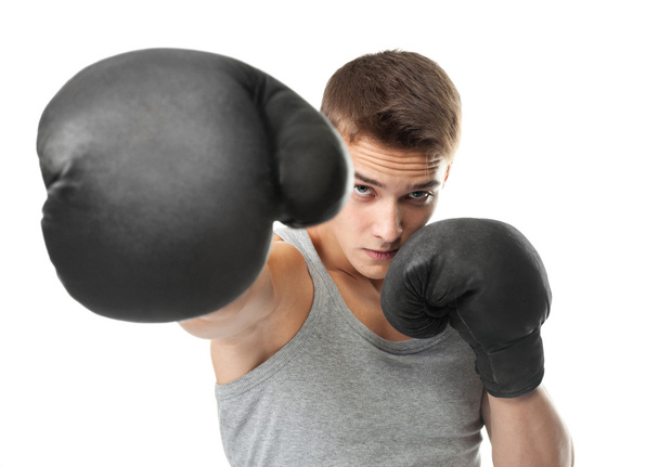 young boxer throwing punch at camera - Foto, Imagem