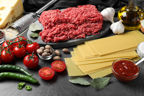 Fresh ingredients for lasagna on grey table - Φωτογραφία, εικόνα