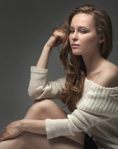 portrait of a beautiful young girl in the studio - Fotó, kép