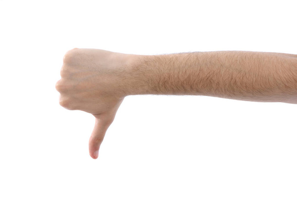Mužská ruka, která ukazuje palec dolů. Izolované na bílém pozadí. Fotka ve vysokém rozlišení. Plná hloubka pole. - Fotografie, Obrázek