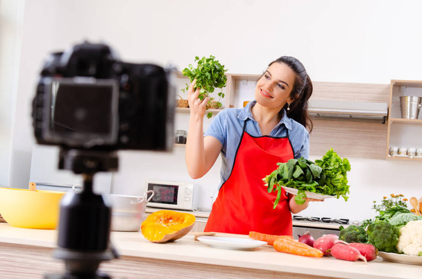 Young female vegetarian recording video for her blog - Foto, imagen