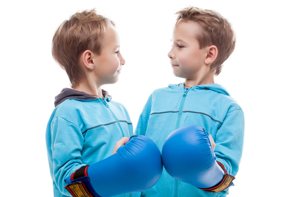 Cute twin boys posing looking at each other - 写真・画像