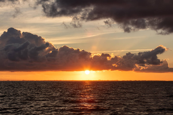 Beautiful sunset by the coast of Belize - Photo, image