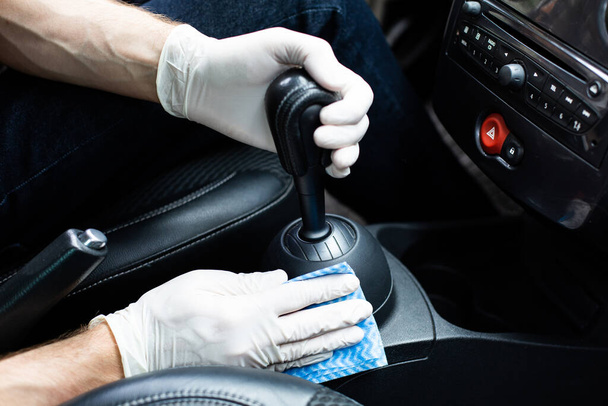 Man cleaning a car interior. Auto detailing. - 写真・画像